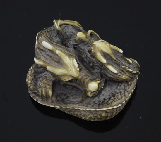 A Japanese stag antler netsuke of two entwined dragons, 20th century, 4.5cm